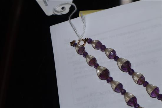 A Chinese amethyst and rock crystal pendant hung from a carved amethyst and rock crystal necklace, pendant 38mm.